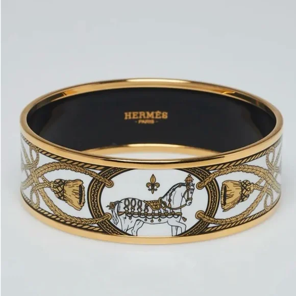 HERMES Black/White and 18k plated enamel bangle. - Picture 1 of 8
